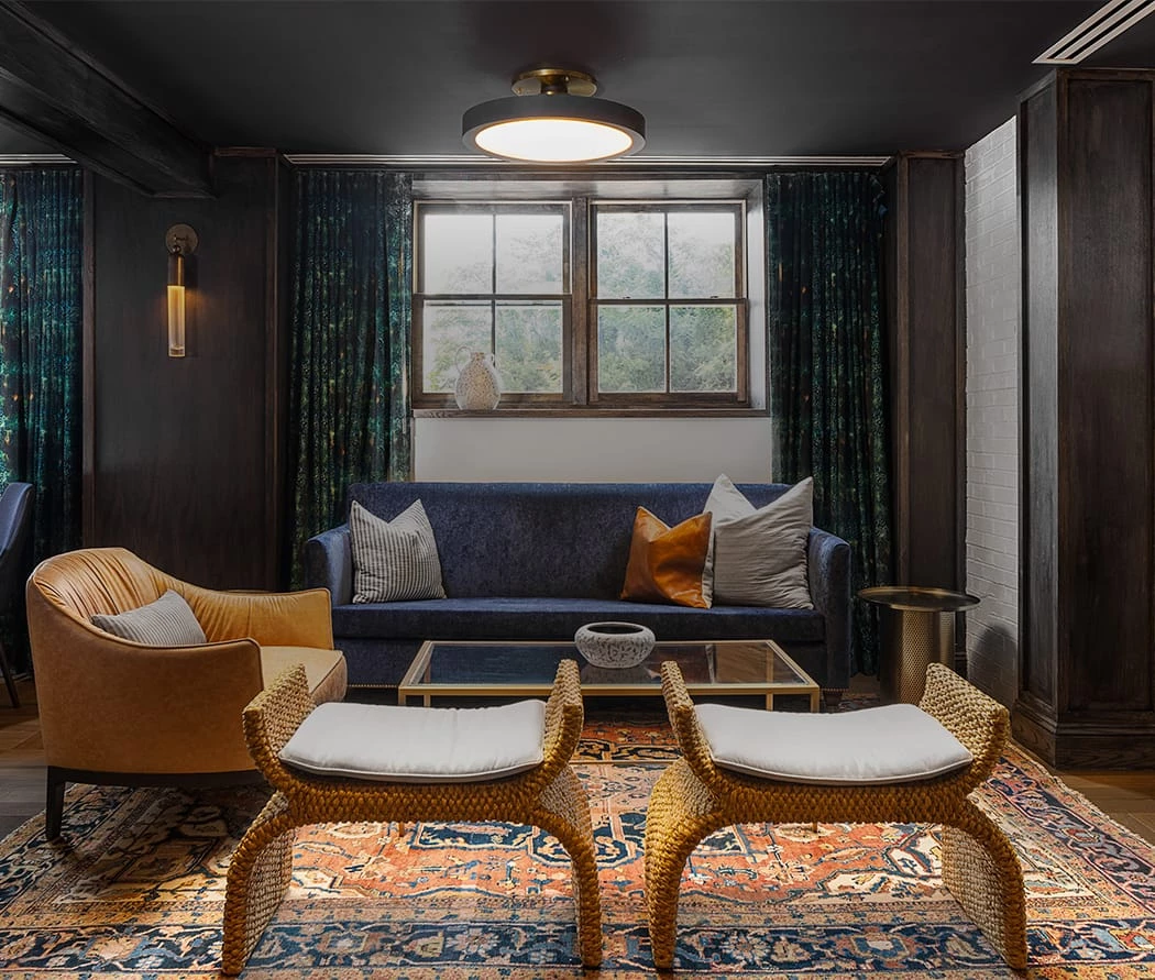 A living room with a couch and chairs at The Wylie Hotel