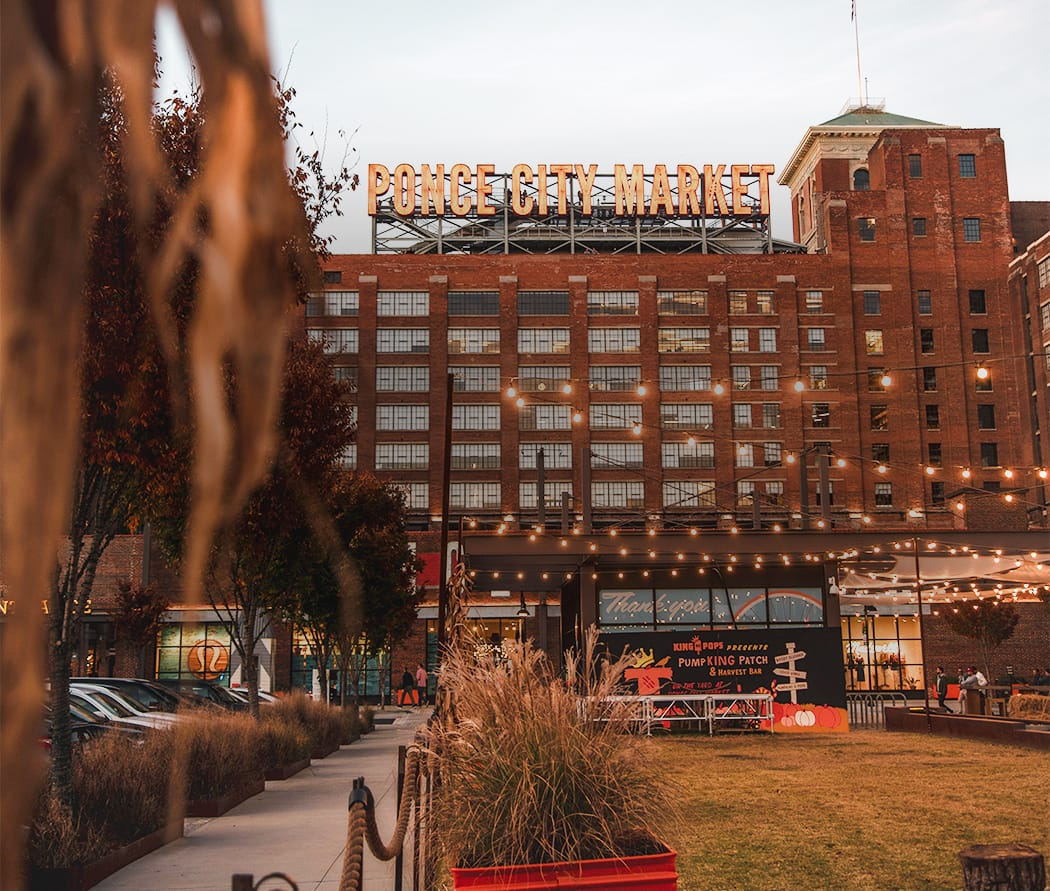 Building with large Pounce City Market sign near The Wylie Hotel in Midtown Atlanta 