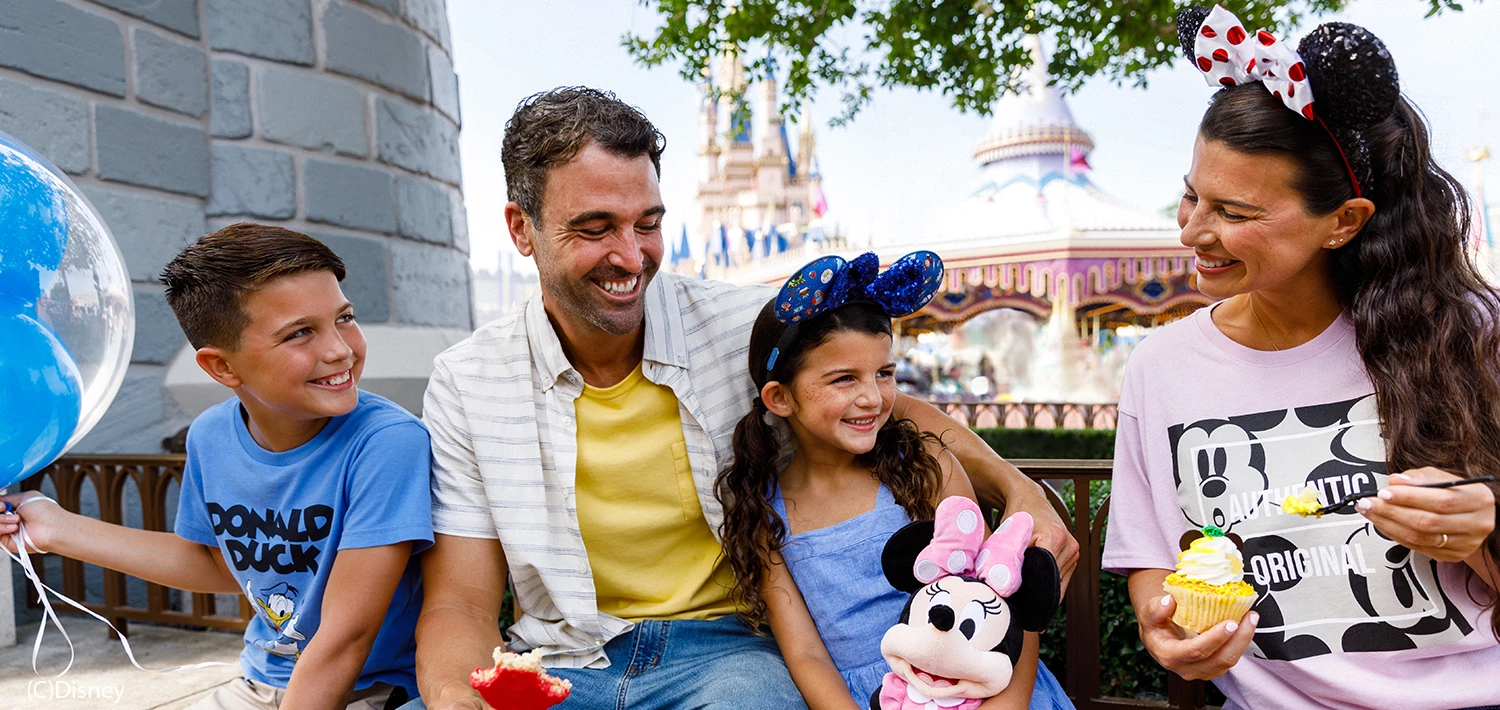 a family sitting outside in an orlando theme park