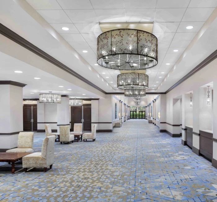 a large room with a chandelier and chairs