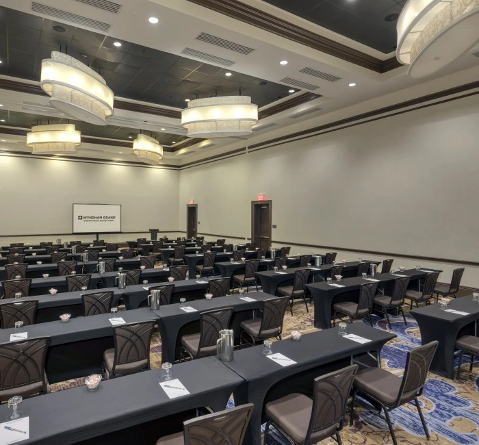 journey meeting venue with chairs and tables lined up facing a screen