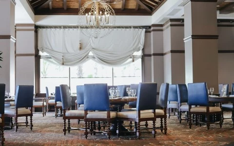 a room with a table and chairs