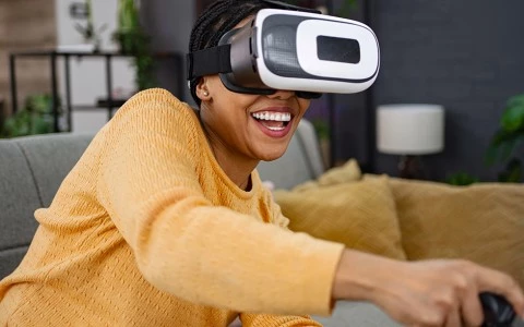 a woman wearing virtual reality goggles