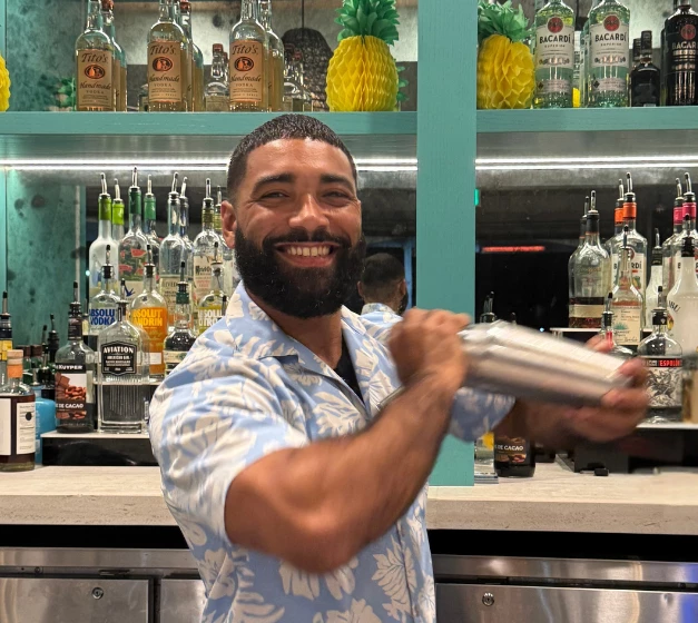 a man holding a shaker