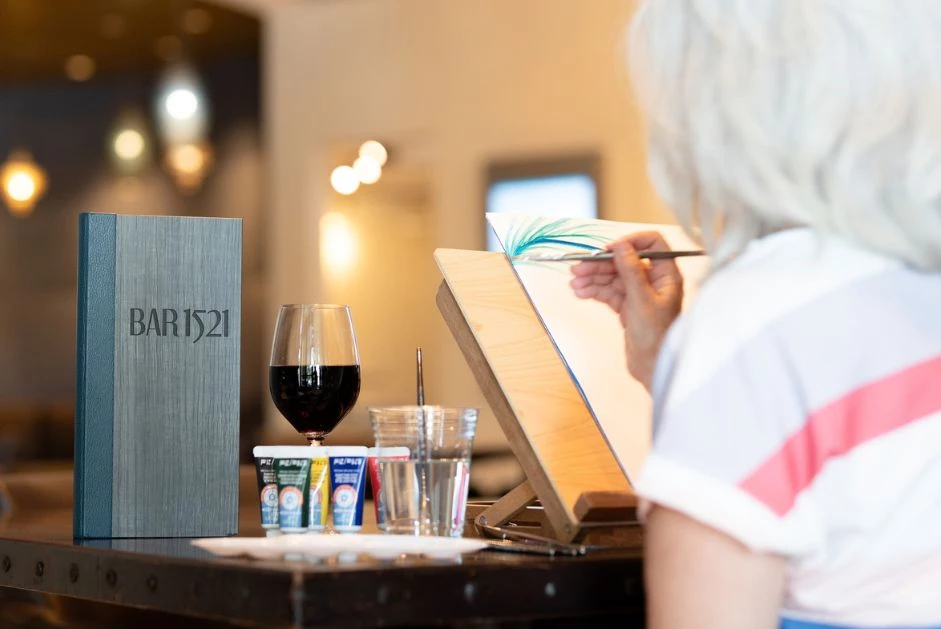 a woman painting a picture