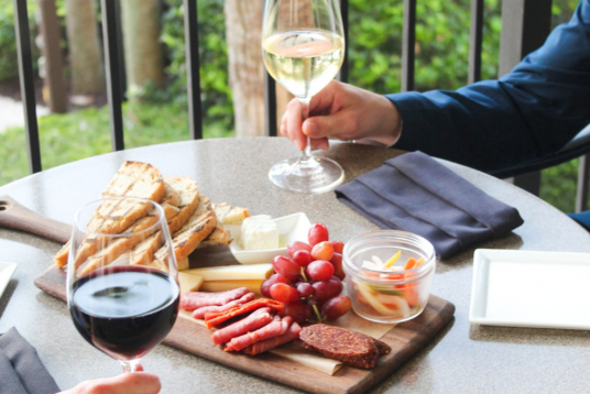 a person holding a glass of wine