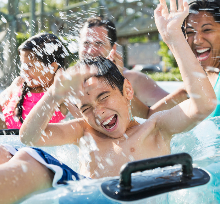 a family enjoying inner tubes on a sunny day