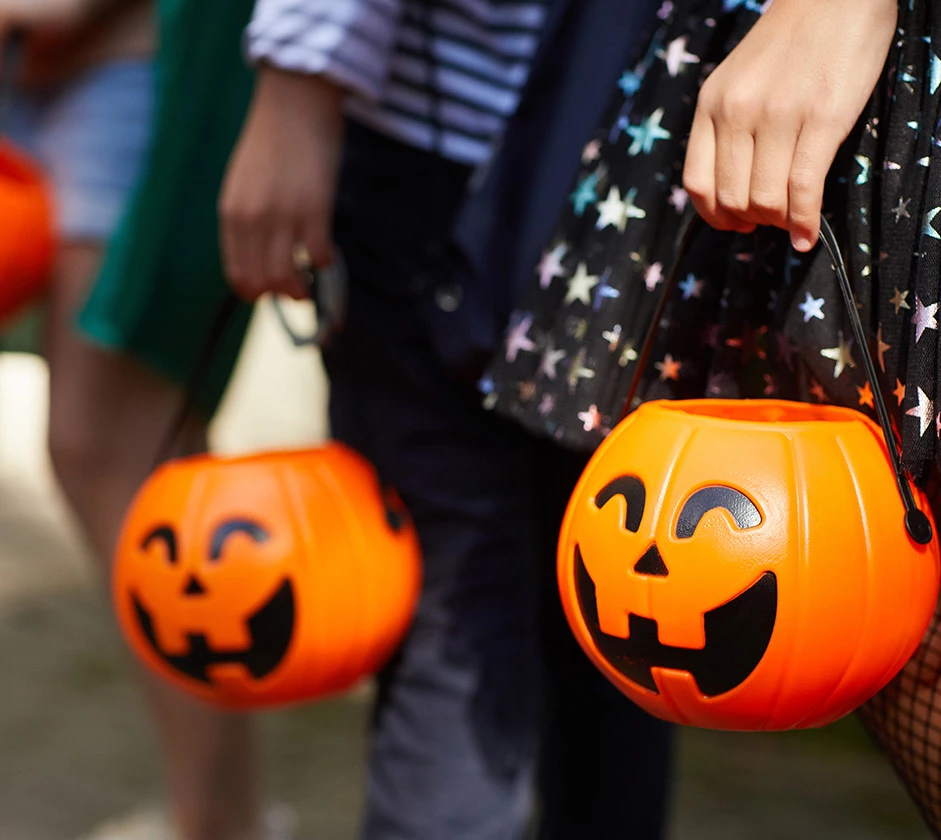 a person holding a pumpkin