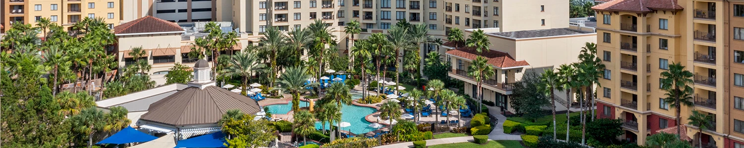 a group of buildings with trees in front of them