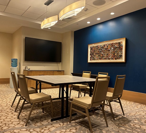 a room with a table and chairs