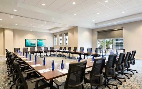 a conference room with tables and chairs