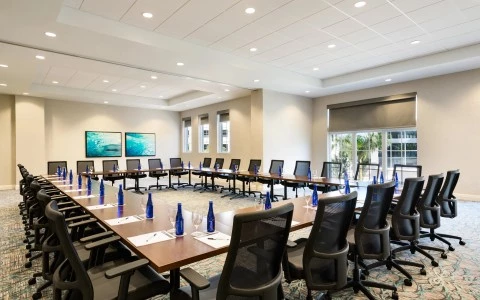 a conference room with tables and chairs