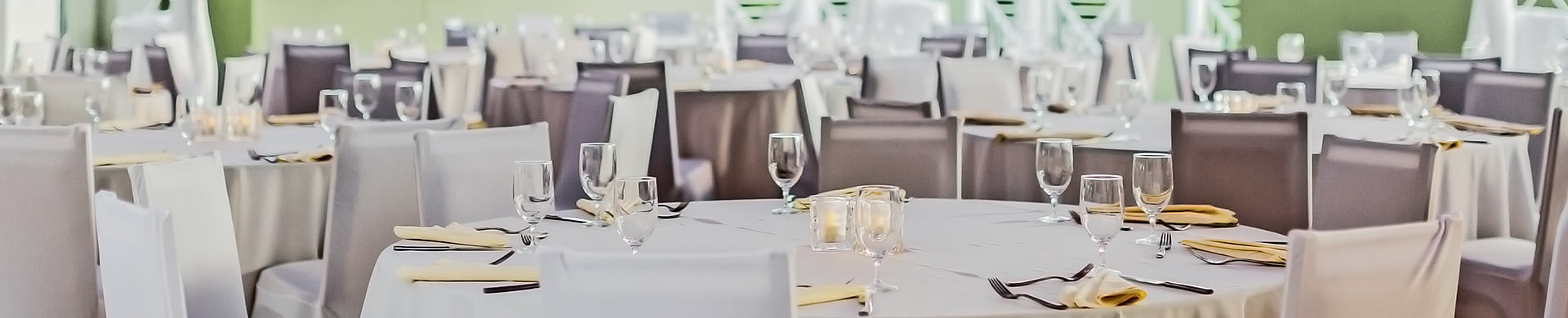 large round tables with white tablecloth