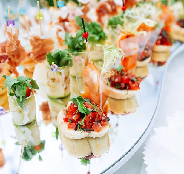 long tray of colorful hor d'eourves 