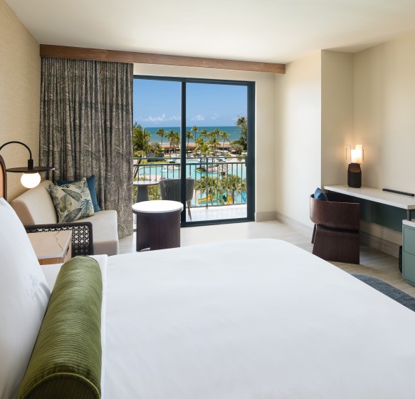 a room with a large window overlooking the ocean