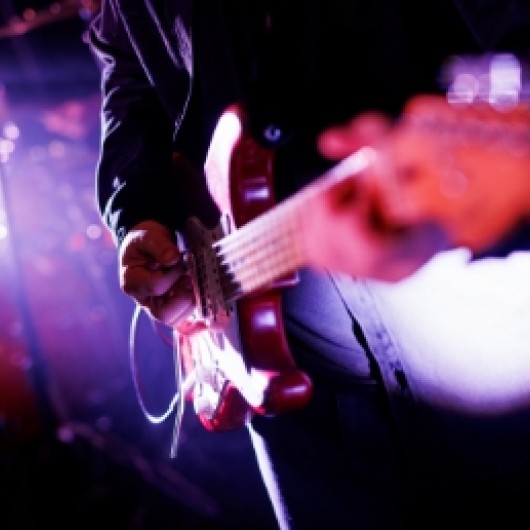 a person playing a guitar