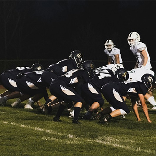 a group of football players on a field