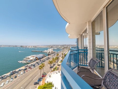 a balcony overlooking a city and water