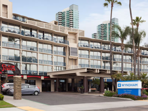 a building with many windows and a parking lot