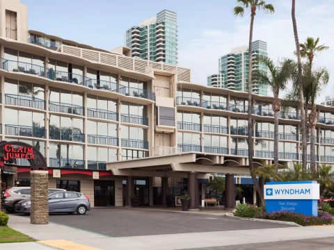 a building with many windows and a parking lot