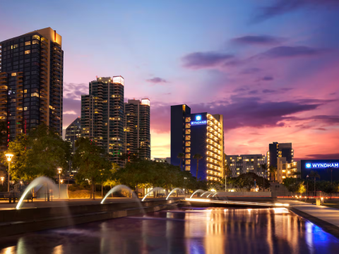 a city skyline with water fountains and buildings