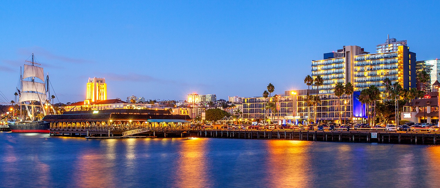 Night view of San Diego Bay with Wyndham San Diego Bayside Hotel in background