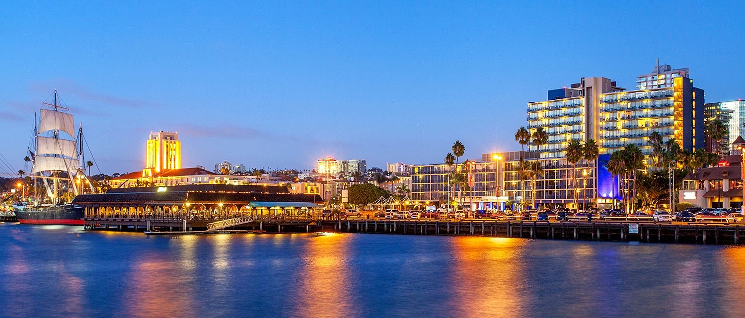 Night view of San Diego Bay with Wyndham San Diego Bayside Hotel in background