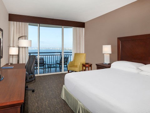 a hotel room with a view of the ocean