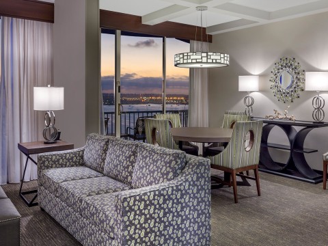a living room with a couch and chairs