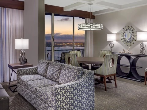 a living room with a couch and chairs