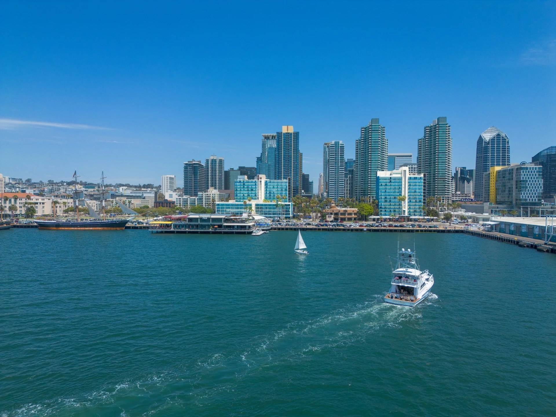 a boat in the water with a city in the background