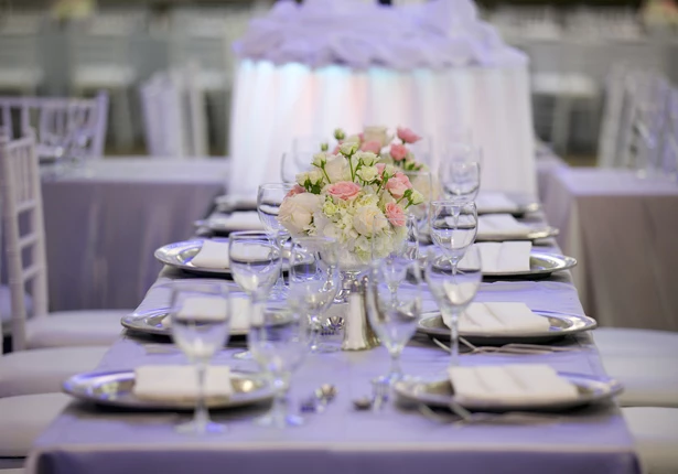 a table with glasses and plates