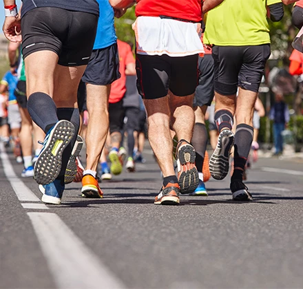 a group of people running on a road