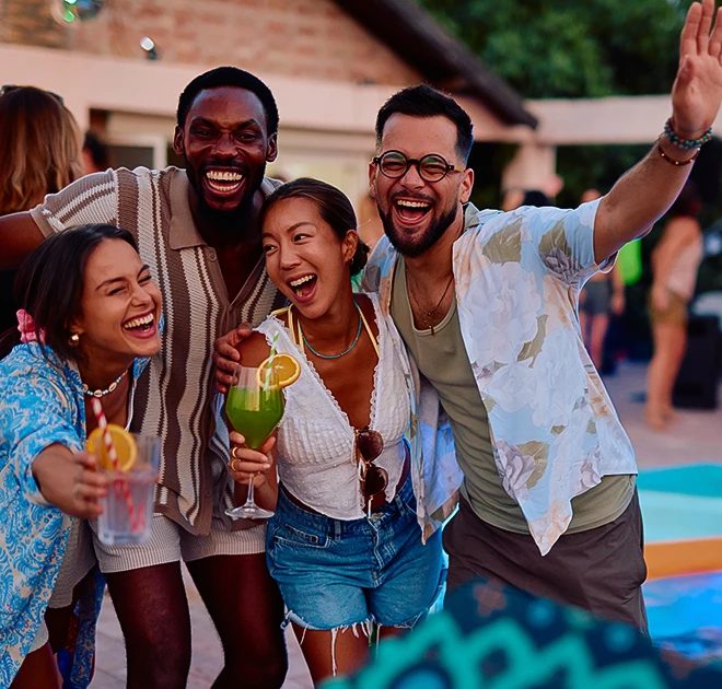 a group of people holding drinks