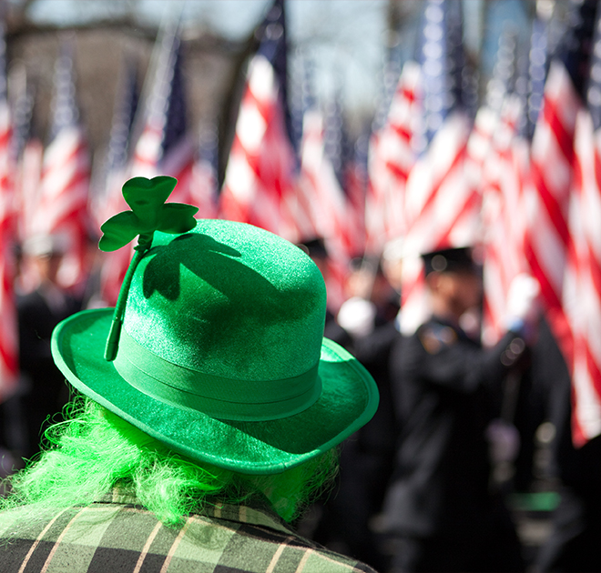 a person wearing a green hat with a shamrock on it