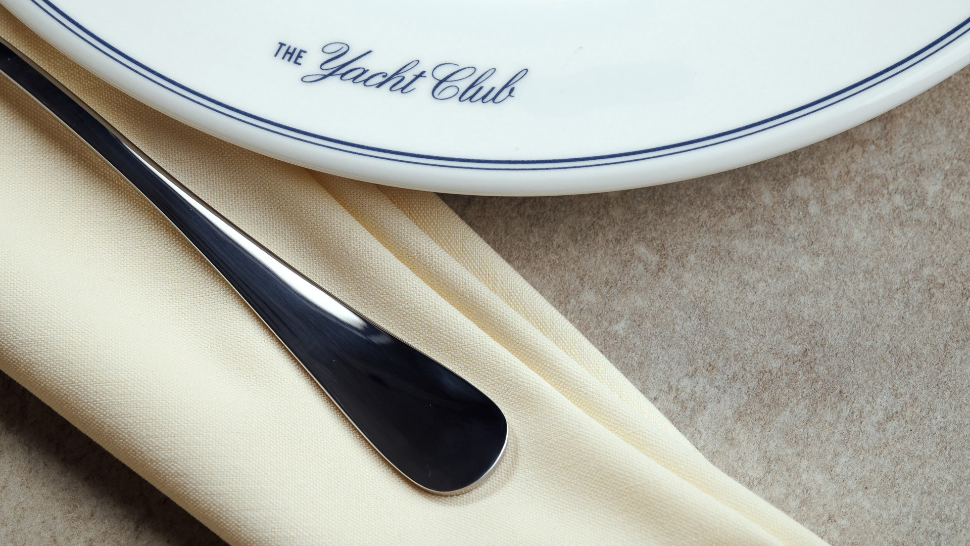 a plate with a knife and napkin