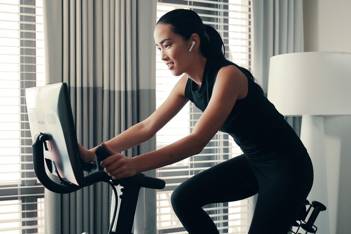 a woman on a stationary bike