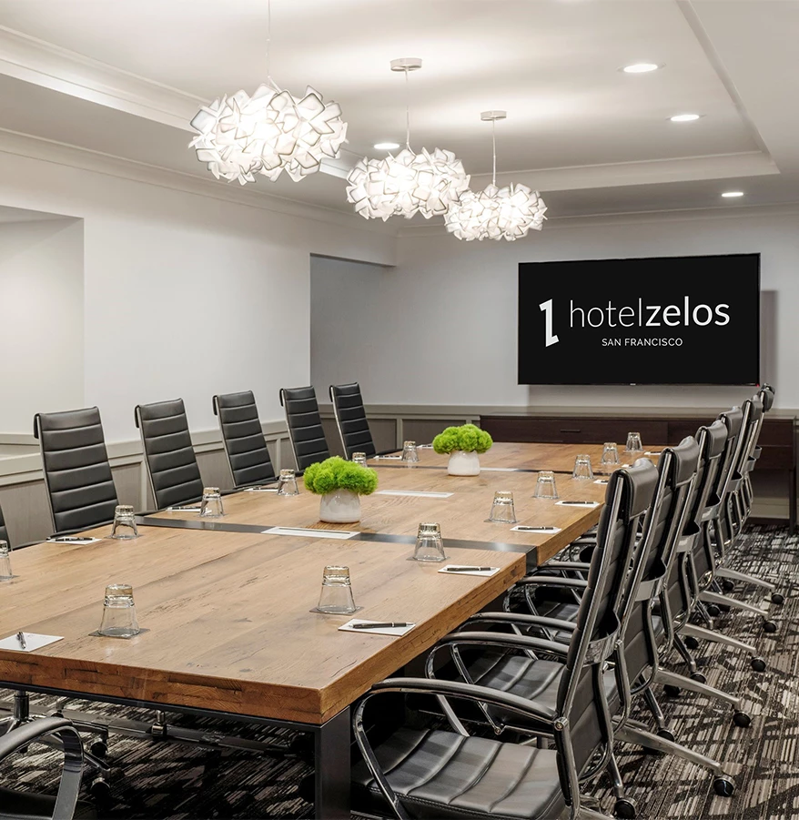 a conference room with a table and chairs