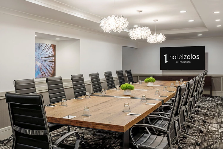 a conference room with a table and chairs