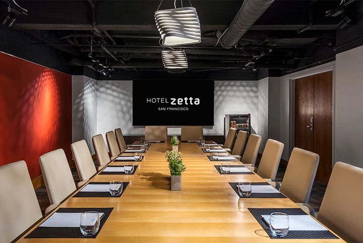 a conference room with a large table and chairs