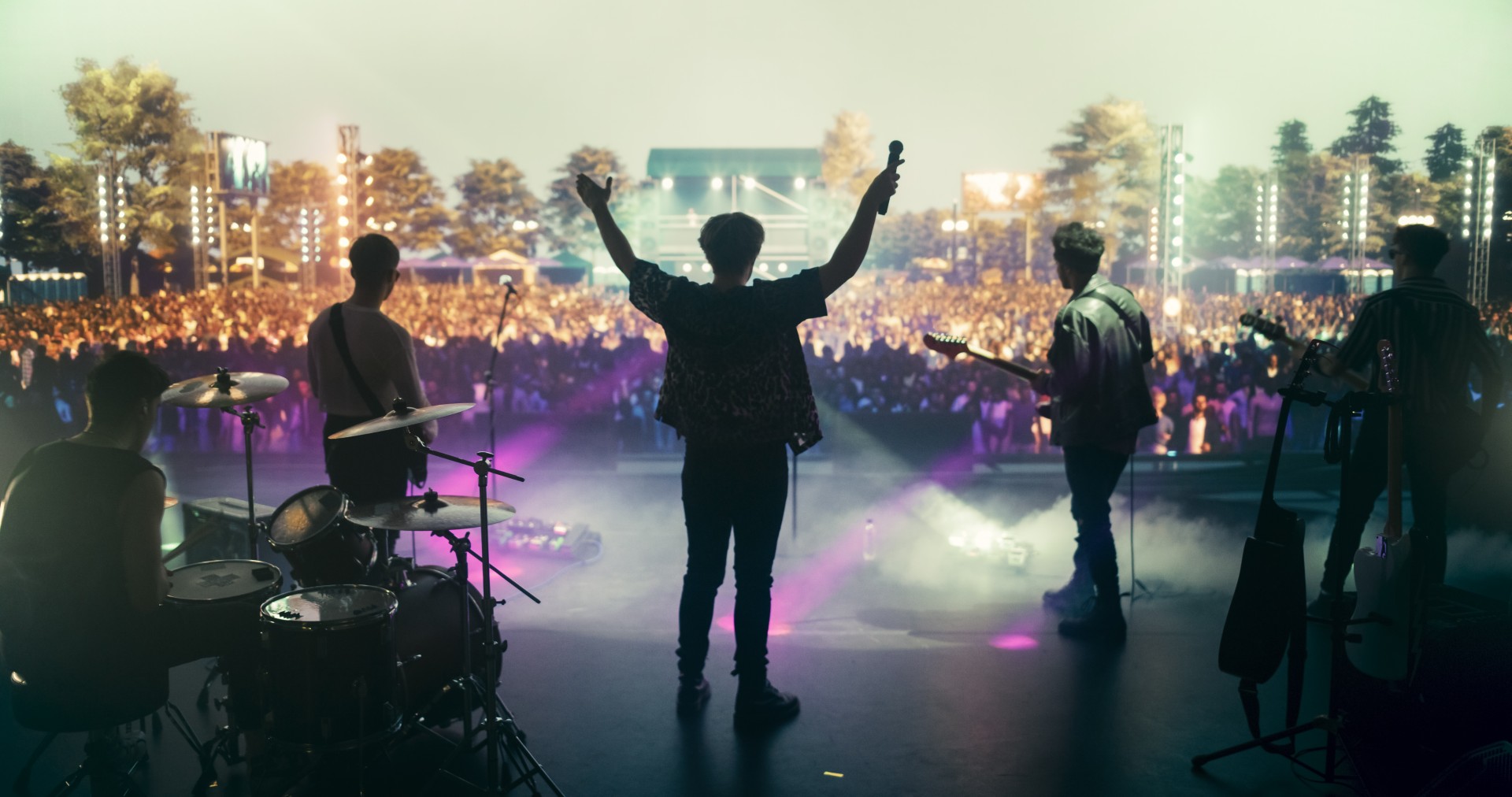 a group of people on a stage with instruments