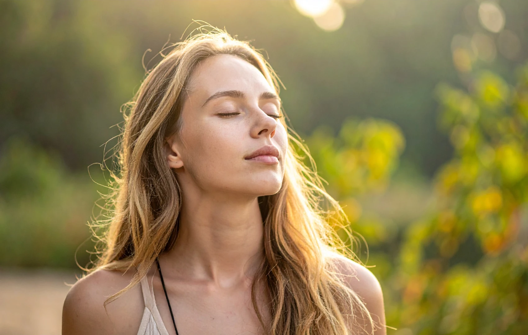 a woman with her eyes closed