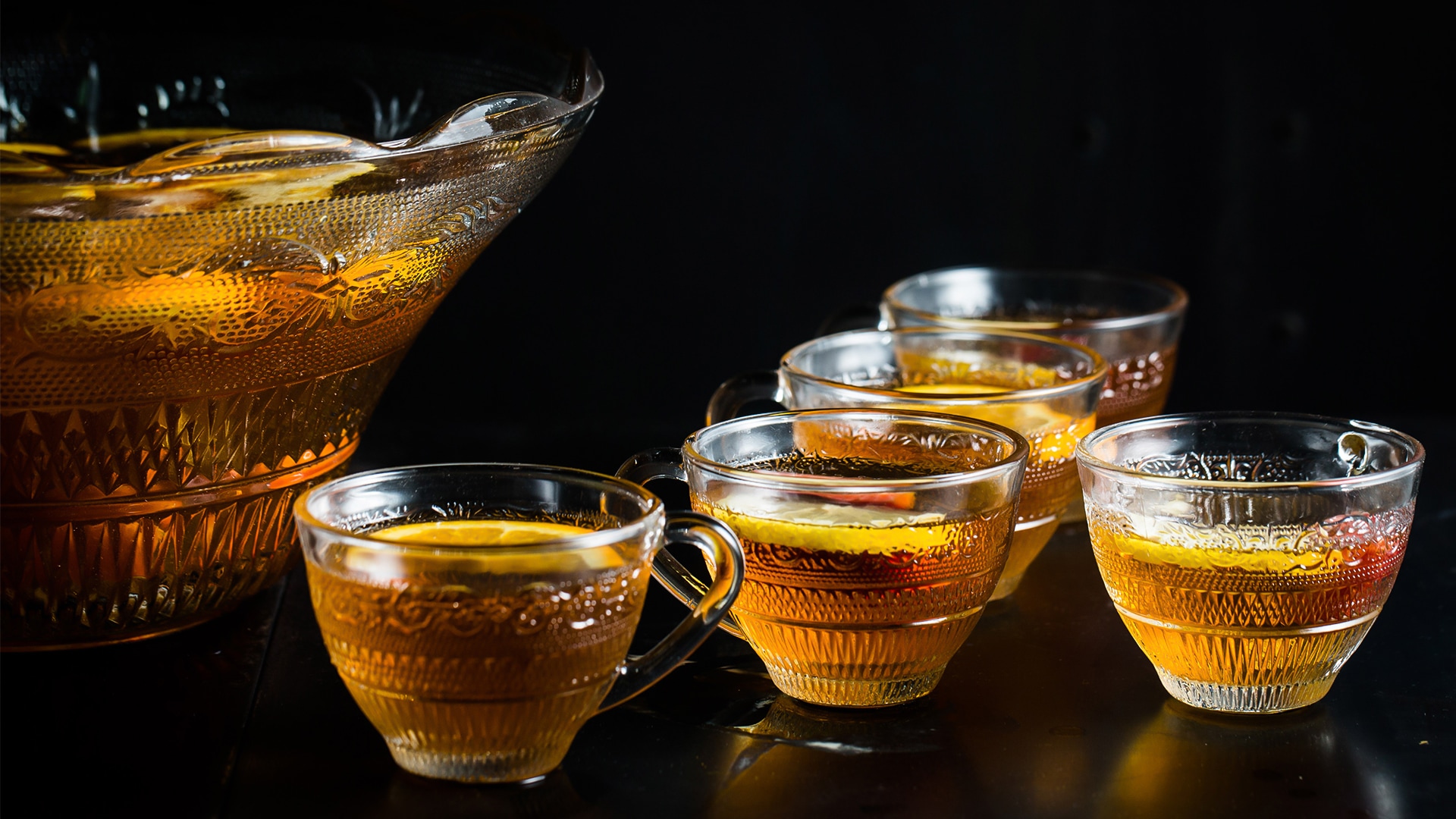 a group of cups of tea with lemons