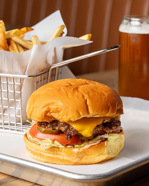 a burger and fries on a plate