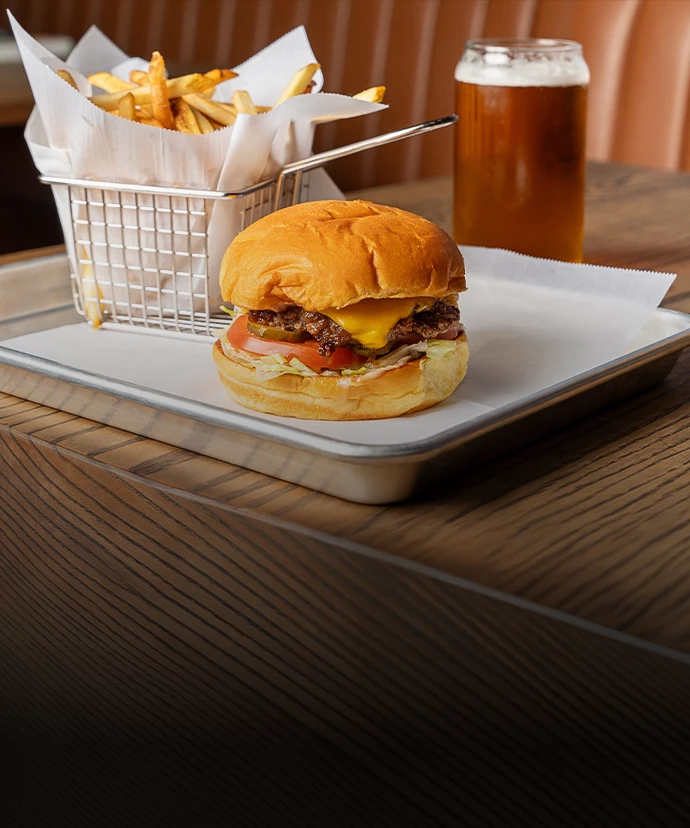 a burger and fries on a tray