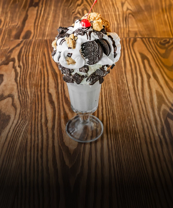 a glass with a sundae on it