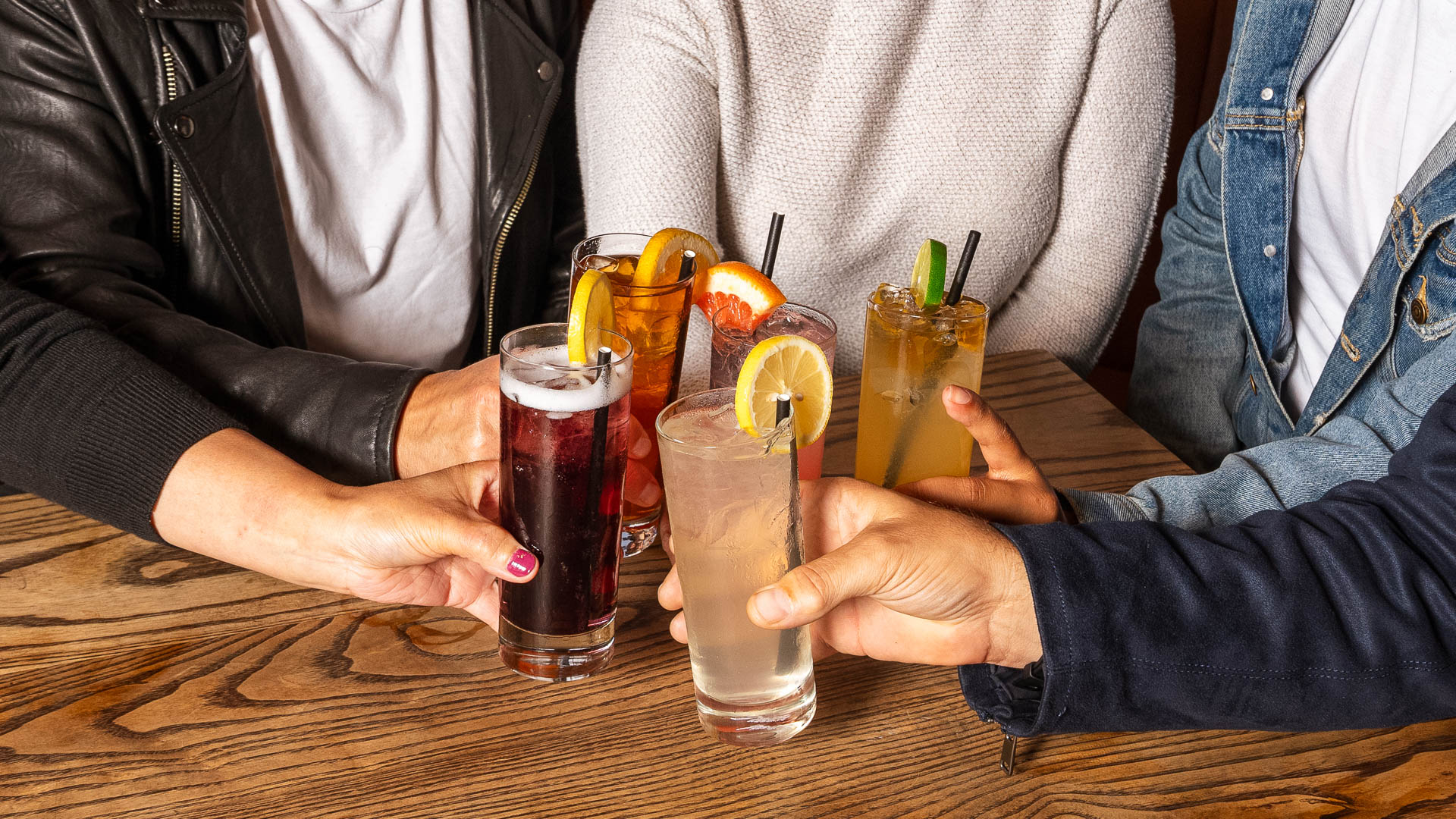 a group of people holding drinks