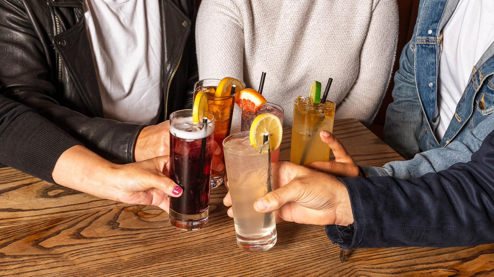 a group of people holding drinks