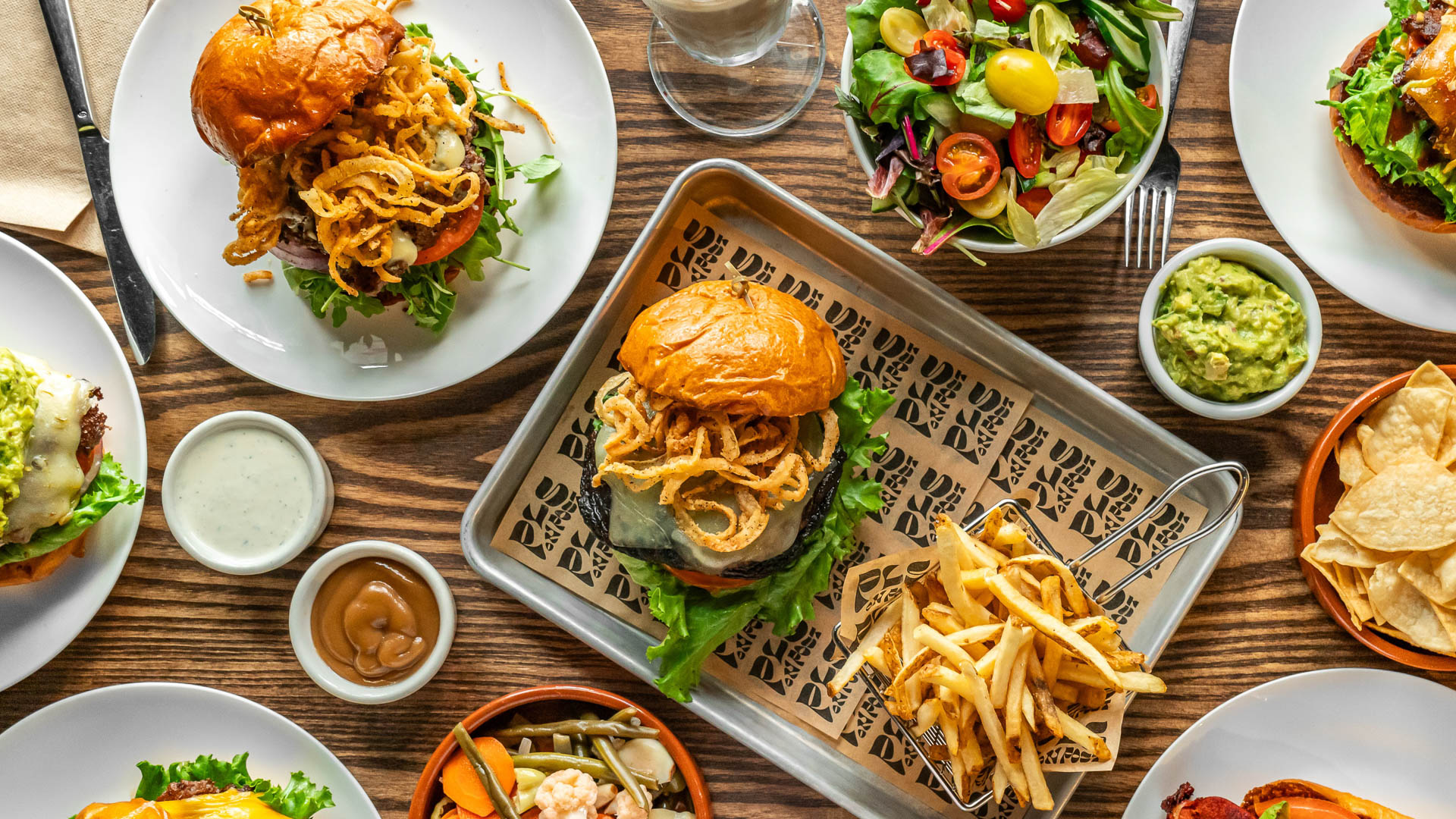 a table with plates of food and drinks