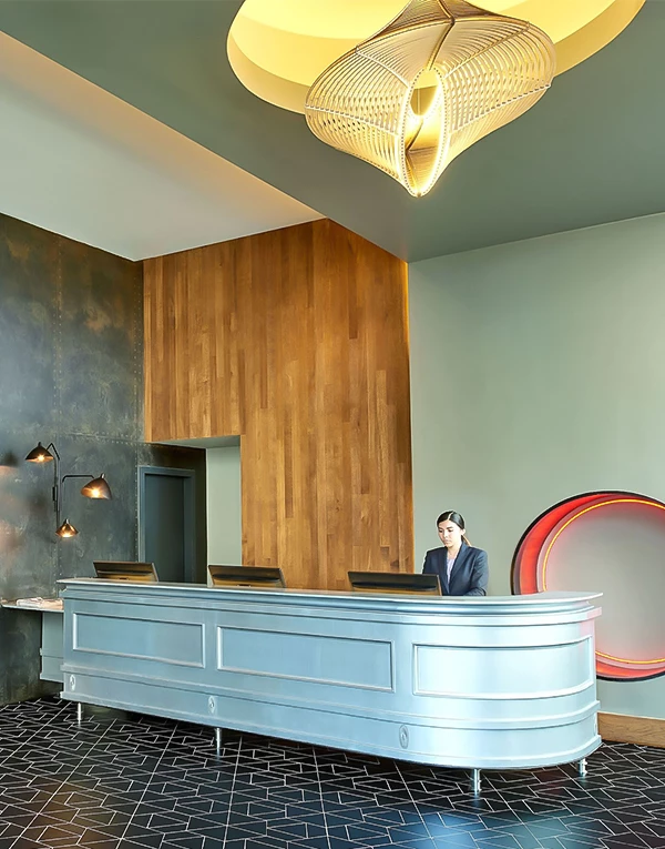 a woman sitting at a reception desk